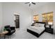 Airy bedroom with an inviting queen bed, contemporary furnishings, and a view of the walk-in closet at 7682 Rafter Ct, Las Vegas, NV 89139
