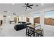 Game room is equipped with air hockey, ample seating, and multiple windows at 7682 Rafter Ct, Las Vegas, NV 89139