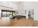 Spacious living room with hardwood floors, tall ceilings, and outdoor access at 7682 Rafter Ct, Las Vegas, NV 89139
