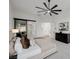 Bright main bedroom features soft carpet, ensuite bath, and views of adjacent rooms at 7682 Rafter Ct, Las Vegas, NV 89139