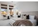Bright main bedroom features sitting area, soft carpet, large windows, and plush furnishings at 7682 Rafter Ct, Las Vegas, NV 89139