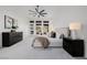 Bright main bedroom features soft carpet, sitting area, large windows, and modern furnishings at 7682 Rafter Ct, Las Vegas, NV 89139