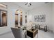 Bright home office features contemporary decor, neutral colors, and large windows offering views of the outdoors at 7682 Rafter Ct, Las Vegas, NV 89139