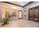 The home features a private patio with a stucco wall and several large windows and doors at 7682 Rafter Ct, Las Vegas, NV 89139