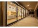 Spacious covered patio with large glass doors, views of living area, stairs, and outdoor bar at 7682 Rafter Ct, Las Vegas, NV 89139