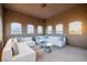 Inviting sitting room with comfortable couches and bright views of neighborhood at 7682 Rafter Ct, Las Vegas, NV 89139