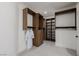 Spacious walk-in closet featuring custom shelving, drawers, and ample hanging space for organized storage at 7682 Rafter Ct, Las Vegas, NV 89139