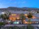 Aerial view of the home shows the backyard pool, patio, desert landscaping and mountain views at 8455 Stange Ave, Las Vegas, NV 89129