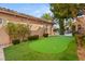 Landscaped backyard with putting green provides outdoor recreation and enhances the beauty of this property at 8455 Stange Ave, Las Vegas, NV 89129