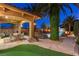 Landscaped backyard features a pool, patio, seating and lush greenery at 8455 Stange Ave, Las Vegas, NV 89129
