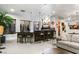 Basement bar area features modern lighting, counter seating, and backyard views at 8455 Stange Ave, Las Vegas, NV 89129