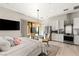Charming suite boasts modern kitchenette and cozy dining area, complemented by soft hues and natural light at 8455 Stange Ave, Las Vegas, NV 89129