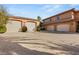 Expansive home featuring multiple garages and a spacious driveway, perfect for car enthusiasts and large families at 8455 Stange Ave, Las Vegas, NV 89129