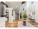 Elegant home foyer featuring a high ceiling, staircase, and hardwood flooring throughout at 8455 Stange Ave, Las Vegas, NV 89129