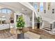 Grand foyer featuring a winding staircase, elegant decor, and hardwood floors at 8455 Stange Ave, Las Vegas, NV 89129