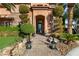 Stunning front entrance with manicured landscaping and elegant lighting fixtures at 8455 Stange Ave, Las Vegas, NV 89129