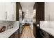 Bright kitchen showcasing stainless steel appliances, white countertops, and wooden floors with an open layout at 8455 Stange Ave, Las Vegas, NV 89129
