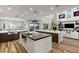 Gourmet kitchen featuring dual islands, custom cabinetry, and eat in dining space at 8455 Stange Ave, Las Vegas, NV 89129