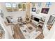 Open-concept living room with fireplace, high ceilings, and views of the outdoor living space at 8455 Stange Ave, Las Vegas, NV 89129
