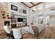 Spacious living room with a stone fireplace, built-in shelving, and lots of natural light at 8455 Stange Ave, Las Vegas, NV 89129