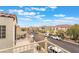 Balcony with seating offers neighborhood views on a clear, sunny day at 9132 Gabardine Ave, Las Vegas, NV 89149