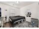 Well-lit bedroom with dark-toned furniture and decor at 9132 Gabardine Ave, Las Vegas, NV 89149