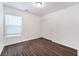 Minimalist bedroom with wood-style flooring and closet at 9132 Gabardine Ave, Las Vegas, NV 89149