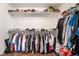 Walk-in closet with extensive built-in shelving and hanging racks for storage at 9132 Gabardine Ave, Las Vegas, NV 89149