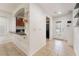 Bright entryway featuring tile flooring, a granite breakfast bar, and a clear view of the contemporary kitchen at 9132 Gabardine Ave, Las Vegas, NV 89149
