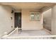 Inviting covered front porch with classic design elements and ample space for outdoor decor and seating at 9132 Gabardine Ave, Las Vegas, NV 89149