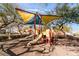 Community playground with multiple slides for the to enjoy at 9132 Gabardine Ave, Las Vegas, NV 89149
