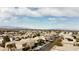 Expansive aerial view showcases a residential community with mountain views and clear blue skies, emphasizing the tranquil setting at 9844 Altadena St, Las Vegas, NV 89183