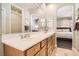 Spacious bathroom features double sinks and access to bedroom at 9844 Altadena St, Las Vegas, NV 89183