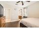 Bedroom with hardwood flooring has access to ensuite bathroom at 9844 Altadena St, Las Vegas, NV 89183