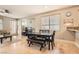 Open concept dining area featuring travertine floors, neutral walls, and lots of light at 9844 Altadena St, Las Vegas, NV 89183