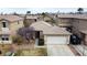 Charming single-story home with a well-maintained front yard and a two-car garage at 9844 Altadena St, Las Vegas, NV 89183