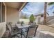 Inviting outdoor patio with a table, six chairs, and desert landscaping for relaxing and entertaining at 9844 Altadena St, Las Vegas, NV 89183