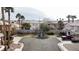 Charming neighborhood street featuring well-maintained homes, palm trees, and lush landscaping in a quiet residential area at 9844 Altadena St, Las Vegas, NV 89183