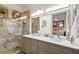 Modern bathroom with double sinks, a glass shower, and stylish fixtures at 10404 Longwood Dr, Las Vegas, NV 89134