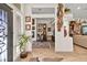 Elegant foyer with hardwood floors, decorative lighting, and a stylish front door, leading to various living spaces at 10404 Longwood Dr, Las Vegas, NV 89134