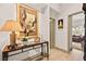Hallway with hardwood floors and decorative lighting that leads to a bedroom with plenty of natural light at 10404 Longwood Dr, Las Vegas, NV 89134