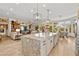 Open kitchen with a large island, stainless steel appliances, and open layout to the living spaces at 10404 Longwood Dr, Las Vegas, NV 89134