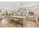 Bright kitchen features a large island with seating, stainless steel appliances, and ample cabinet space at 10404 Longwood Dr, Las Vegas, NV 89134