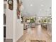 Open-concept living room and kitchen with hardwood floors, recessed lighting, and large windows offering backyard views at 10404 Longwood Dr, Las Vegas, NV 89134
