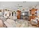 Spacious living room featuring a ceiling fan, hardwood floors and plenty of natural light at 10404 Longwood Dr, Las Vegas, NV 89134