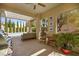 Relaxing covered patio area with comfortable seating and views of the swimming pool and backyard at 10404 Longwood Dr, Las Vegas, NV 89134