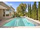 Backyard swimming pool with hot tub, water feature, and privacy landscaping at 10404 Longwood Dr, Las Vegas, NV 89134