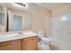 Bathroom with single sink vanity, large mirror, and tile flooring with a tub and shower combo at 1142 Heavenly Harvest Pl # 2, Henderson, NV 89002
