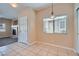 Cozy dining area with tiled floors, bright window, and modern lighting fixture at 1142 Heavenly Harvest Pl # 2, Henderson, NV 89002