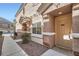 Welcoming townhome front entrance with landscaped walkway and cozy front porch at 1142 Heavenly Harvest Pl # 2, Henderson, NV 89002